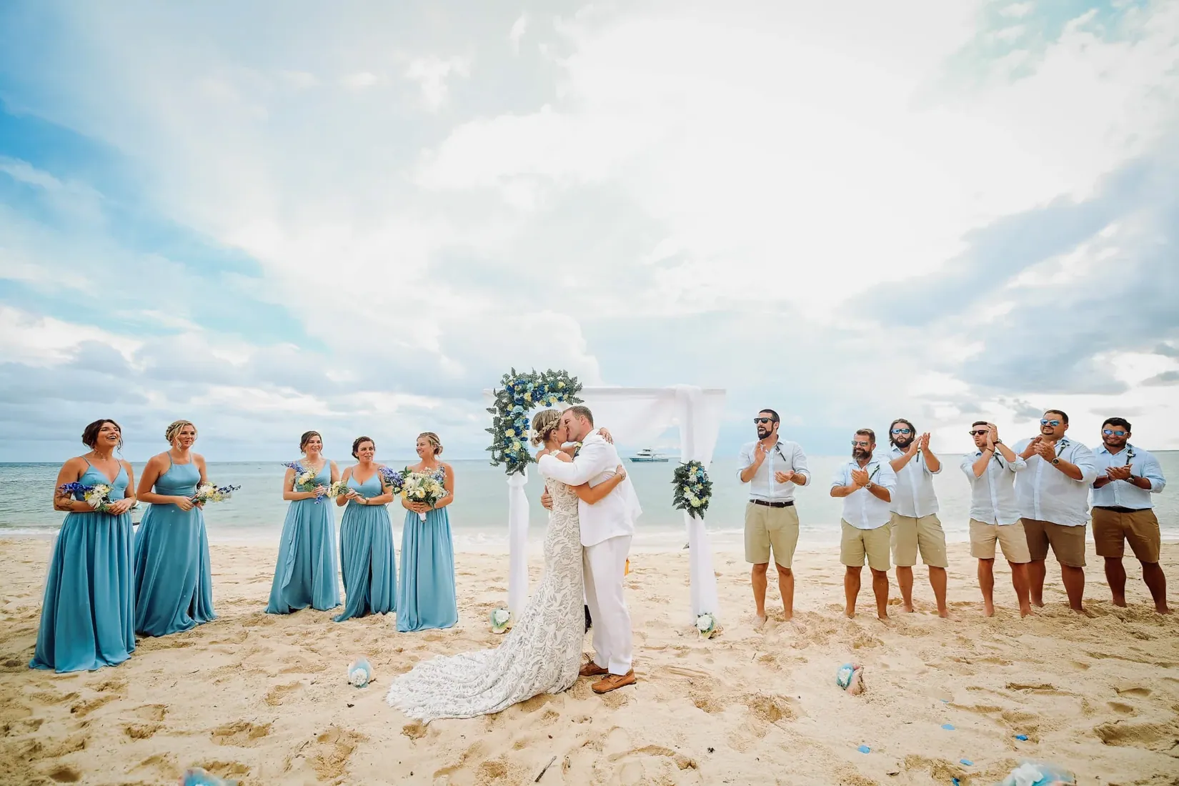 Wedding party lined up beside the sea in Grand Cayman