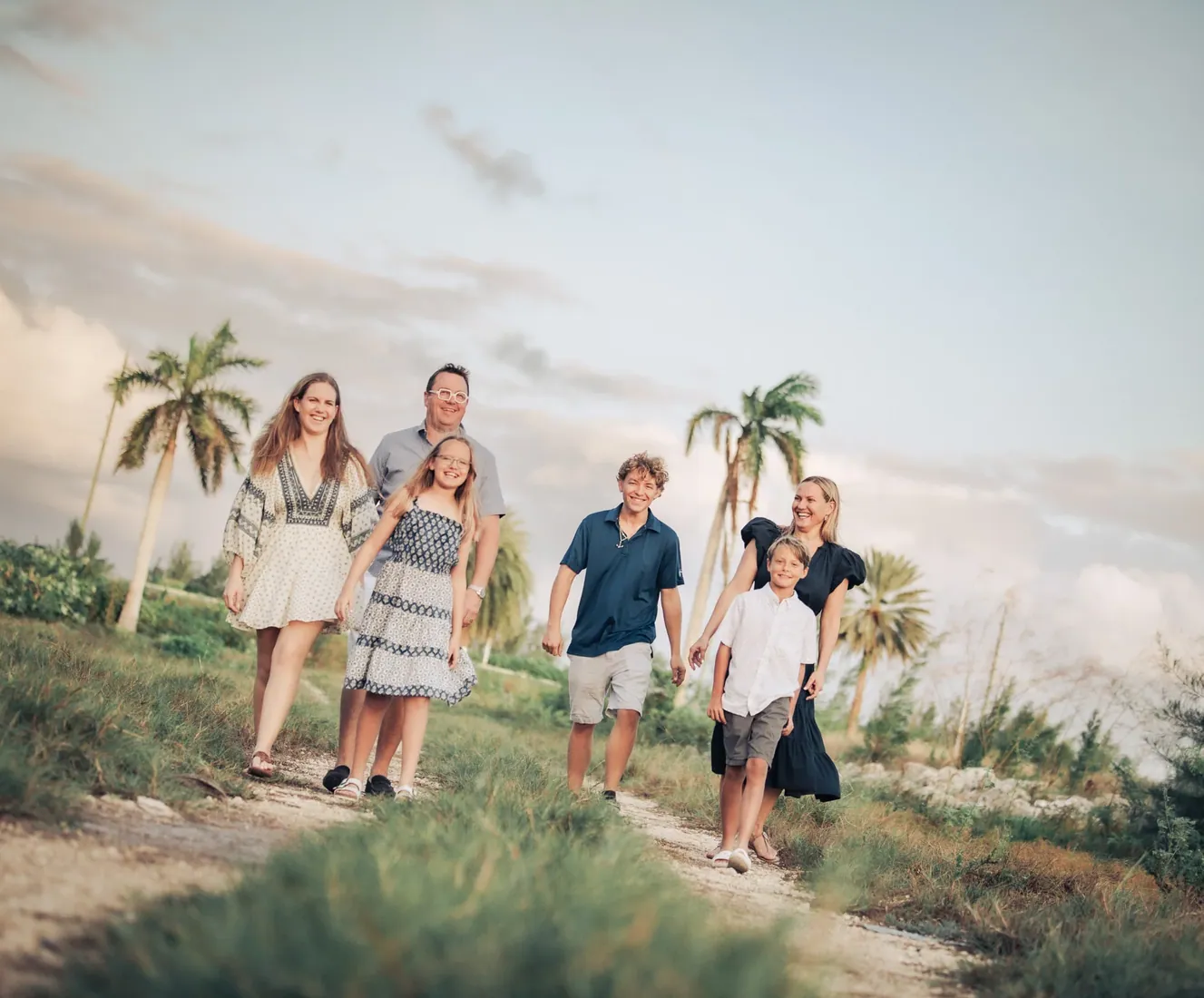 Family walking in soft island light in Grand Cayman