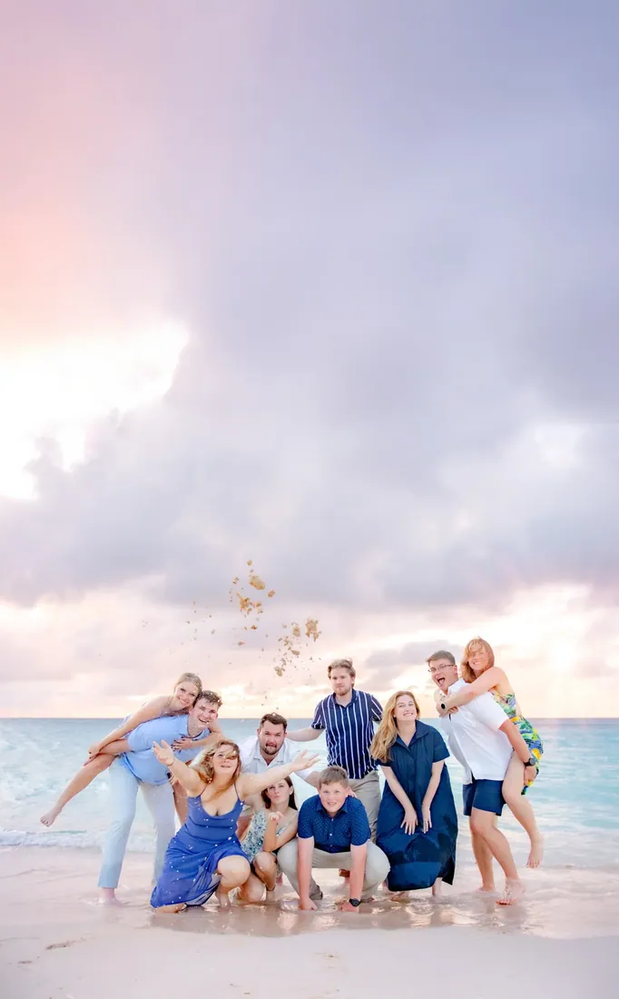 Extended family seated together at sunset in Grand Cayman