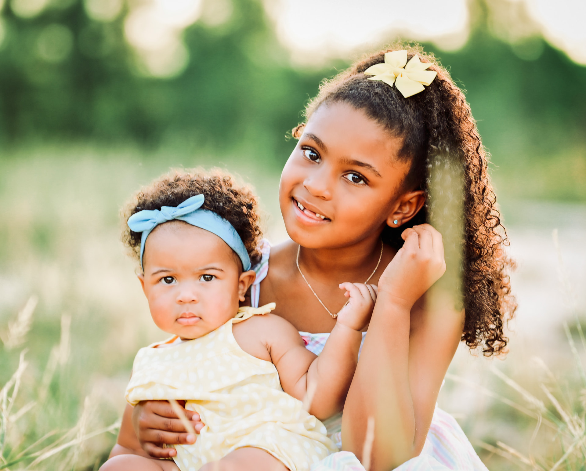 Mother and baby outdoors in soft light