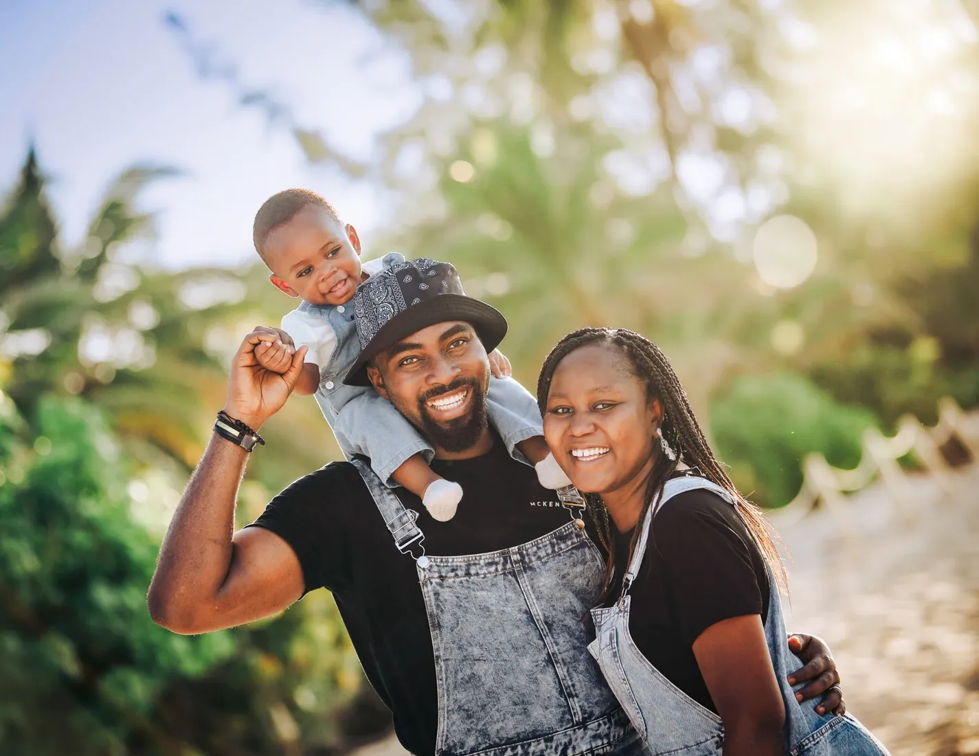 Parents laughing with their little boy outdoors in Grand Cayman