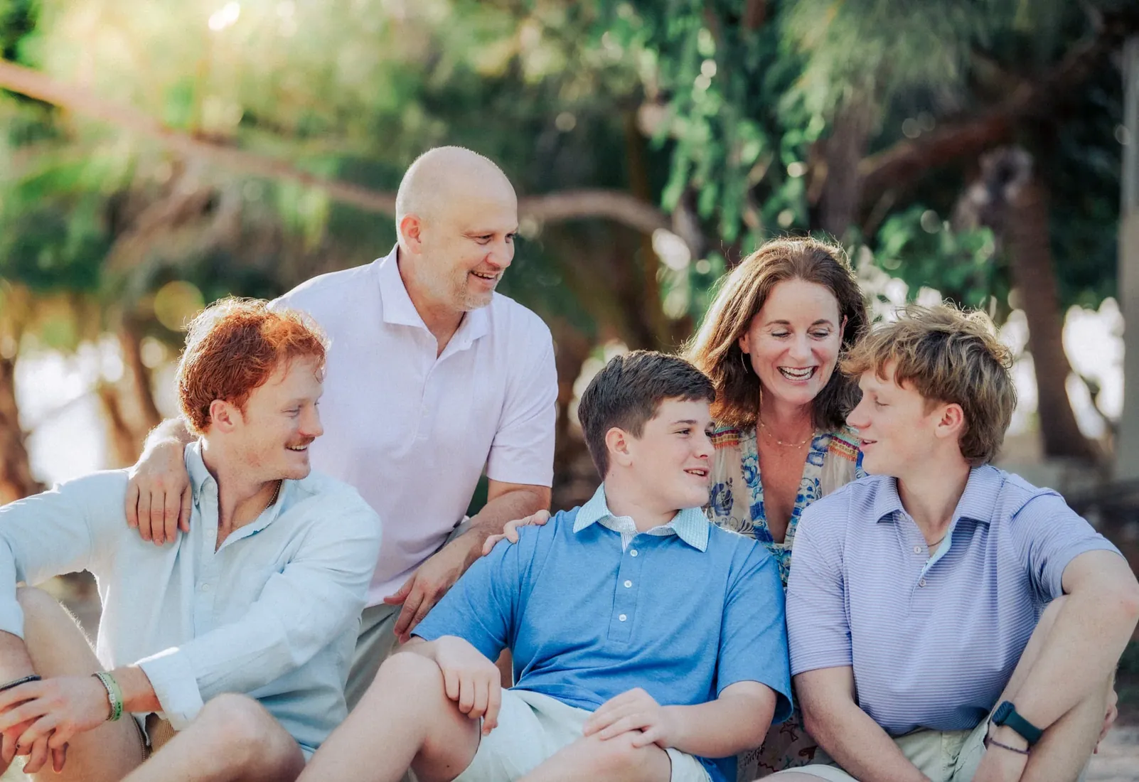 Family laughing together outdoors in Grand Cayman