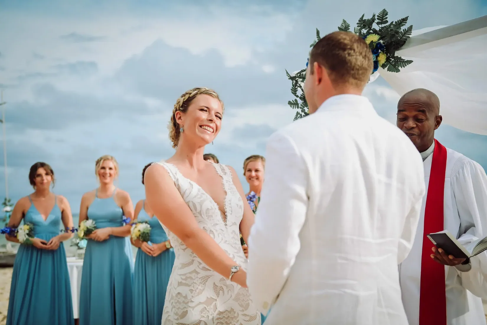 Bride smiling at the groom during the ceremony in Grand Cayman