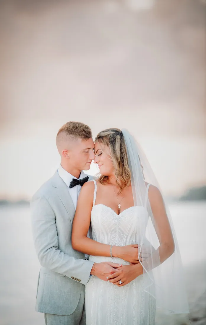 Bride and groom resting their foreheads together in Grand Cayman
